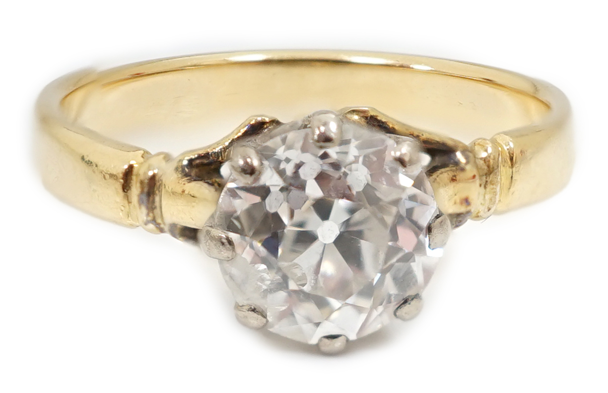 A gold and solitaire diamond set ring
